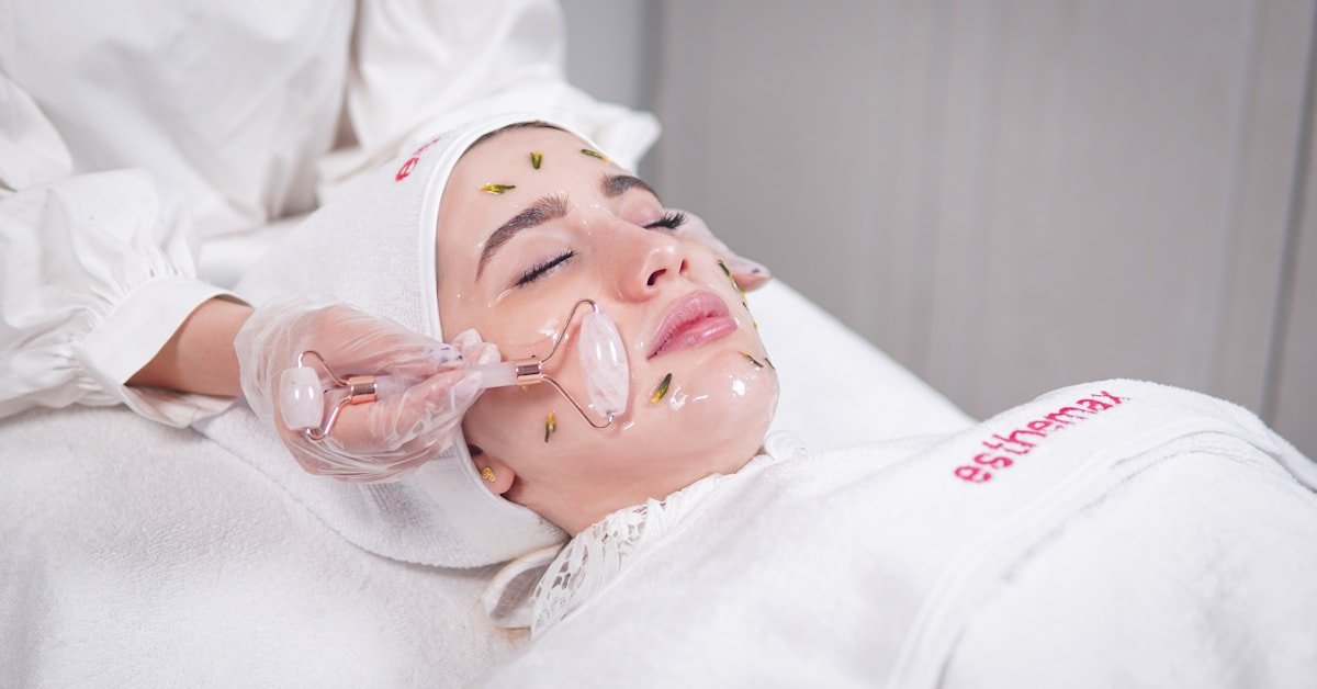 Woman getting facial mask applied