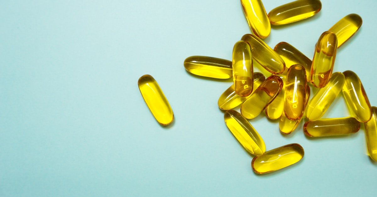 Brown and yellow supplement tablets